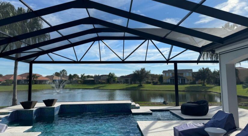 screen pool enclosure for florida pool overlooking lake